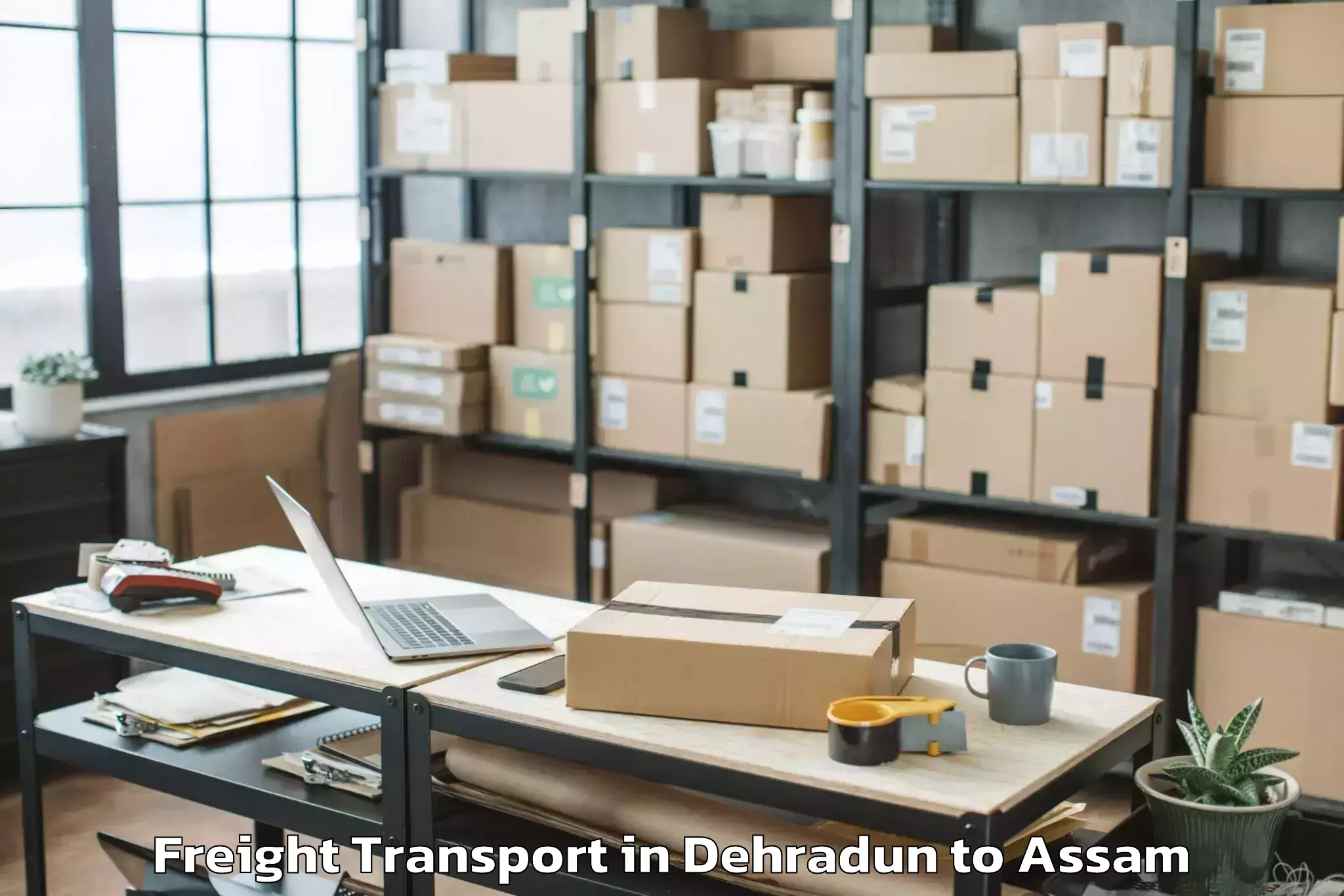 Book Dehradun to Demow Freight Transport